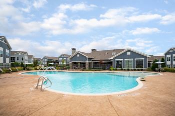 Resort-style swimming pool with cabanas